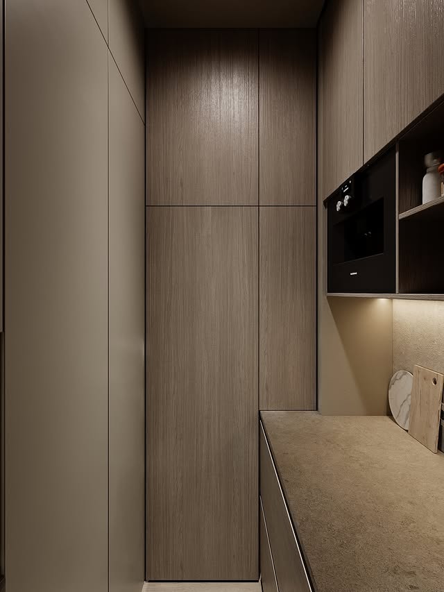 Rénovation minimaliste beige et bois clair dans un appartement à Paris 16e